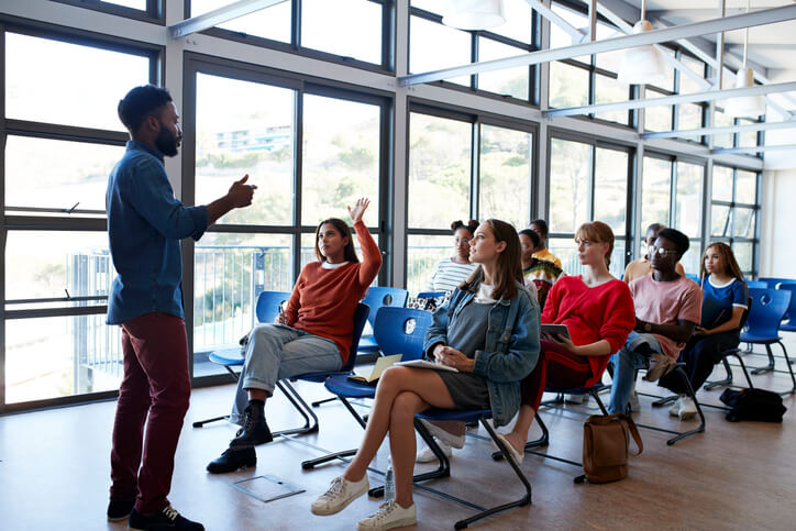 A professional delivering a presentation to employees